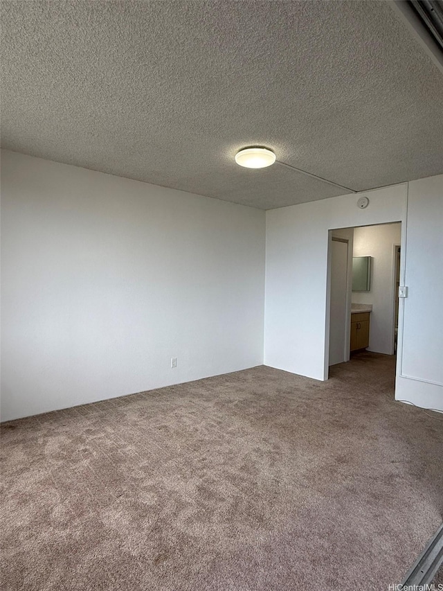 55 S Kukui St Unit D1410, Honolulu, HI 96813 - carpeted spare room with a textured ceiling
