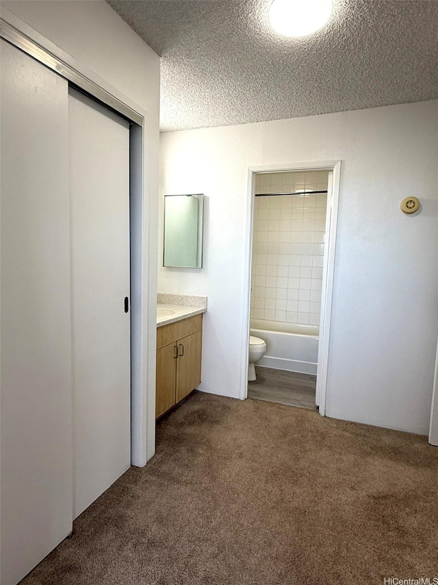 55 S Kukui St Unit D1410, Honolulu, HI 96813 - full bathroom with carpet flooring, vanity, a textured ceiling, and bathing tub / shower combination