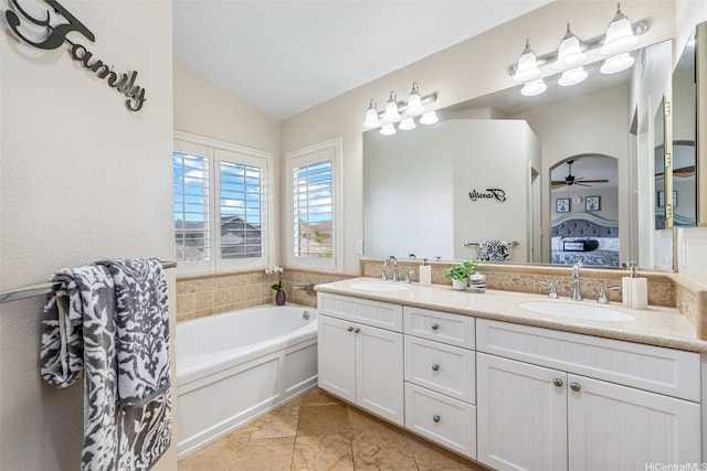 91-1030 Kai Uhu St, Ewa Beach, HI 96706 - bathroom featuring ensuite bath, double vanity, vaulted ceiling, a garden tub, and ceiling fan