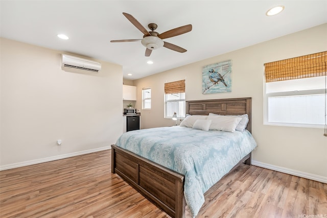 91-1030 Kai Uhu St, Ewa Beach, HI 96706 - bedroom featuring a wall unit AC, light wood finished floors, recessed lighting, and a ceiling fan