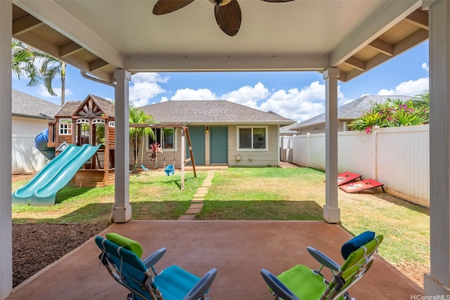 91-1030 Kai Uhu St, Ewa Beach, HI 96706 - fenced backyard with a playground, a ceiling fan, and a patio area