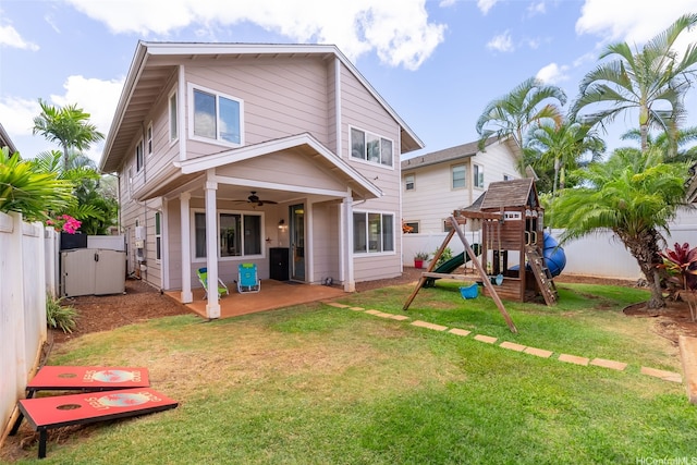 91-1030 Kai Uhu St, Ewa Beach, HI 96706 - rear view of house featuring a ceiling fan, a fenced backyard, a patio, and a playground