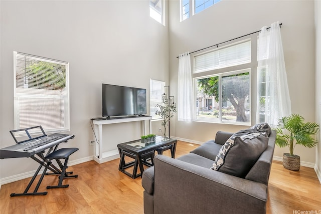 91-1030 Kai Uhu St, Ewa Beach, HI 96706 - living area featuring wood finished floors and a towering ceiling