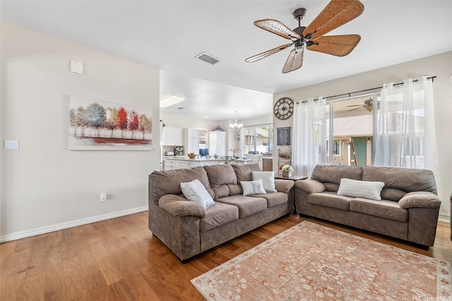 91-1030 Kai Uhu St, Ewa Beach, HI 96706 - living room featuring ceiling fan, a chandelier, and wood finished floors