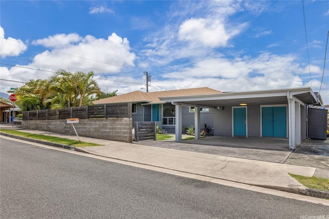 1384 Nanawale Pl, Kailua, HI 96734 - ranch-style house featuring a fenced front yard, a carport, and driveway