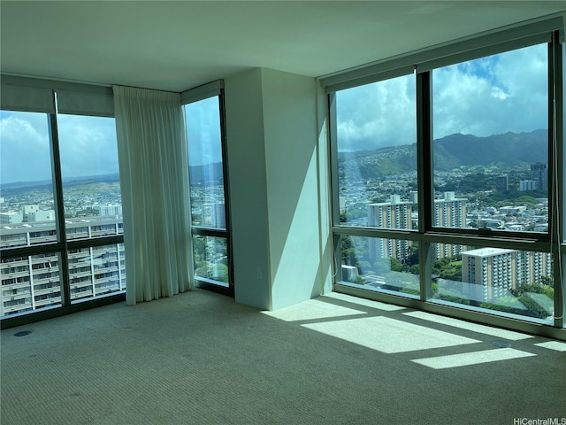 1200 Queen Emma St Unit 3511, Honolulu, HI 96813 - carpeted empty room featuring a wall of windows, a city view, and a mountain view