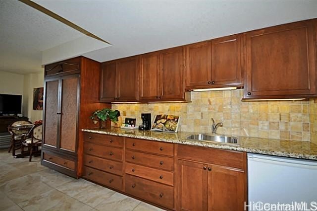 2045 Kalakaua Ave Unit 114, Honolulu, HI 96815 - kitchen featuring dishwasher, backsplash, and light stone counters