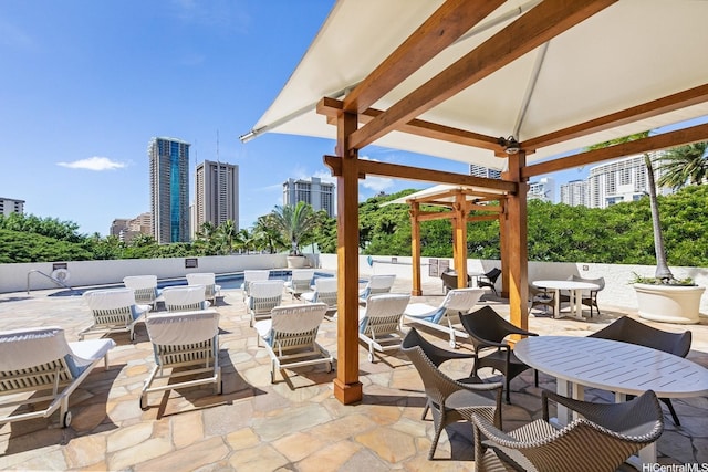 2045 Kalakaua Ave Unit 114, Honolulu, HI 96815 - view of patio / terrace with a view of city, a gazebo, and outdoor dining space