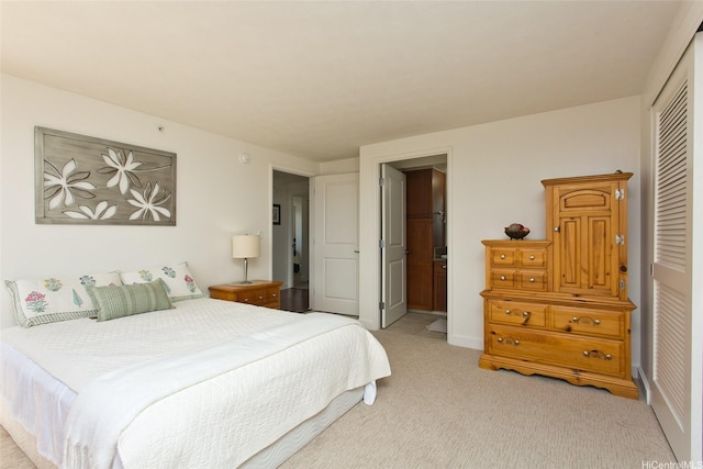 343 Hobron Ln Unit 3401, Honolulu, HI 96815 - bedroom with light colored carpet, a closet, and connected bathroom