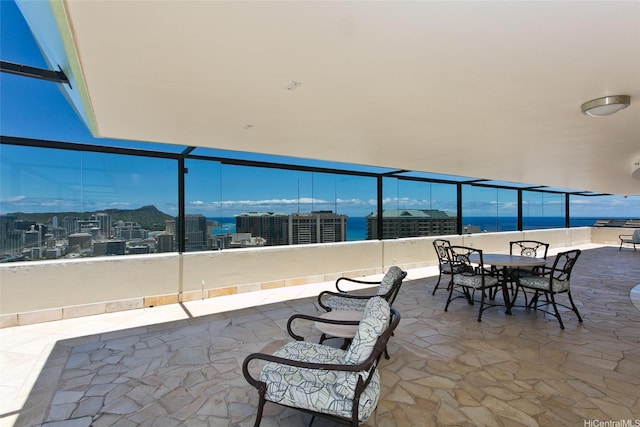 343 Hobron Ln Unit 3401, Honolulu, HI 96815 - view of patio / terrace featuring a city view and outdoor dining area