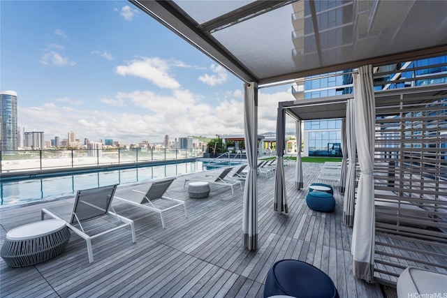 629 Keeaumoku St Unit 2408, Honolulu, HI 96814 - wooden terrace with a community pool and a view of city
