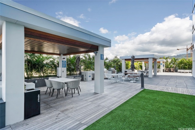 629 Keeaumoku St Unit 2408, Honolulu, HI 96814 - wooden deck with a gazebo, outdoor dining area, and a yard