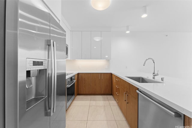 629 Keeaumoku St Unit 2408, Honolulu, HI 96814 - kitchen with appliances with stainless steel finishes, brown cabinets, white cabinetry, modern cabinets, and light countertops
