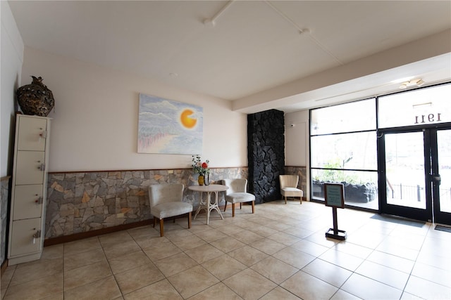 1911 Kalakaua Ave Unit 209, Honolulu, HI 96815 - living area featuring light tile patterned floors and wainscoting