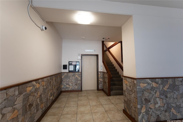 1911 Kalakaua Ave Unit 209, Honolulu, HI 96815 - stairs with elevator, wainscoting, and tile patterned flooring