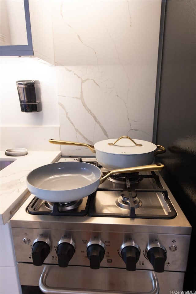 1911 Kalakaua Ave Unit 209, Honolulu, HI 96815 - detailed view of gas stove and light stone counters