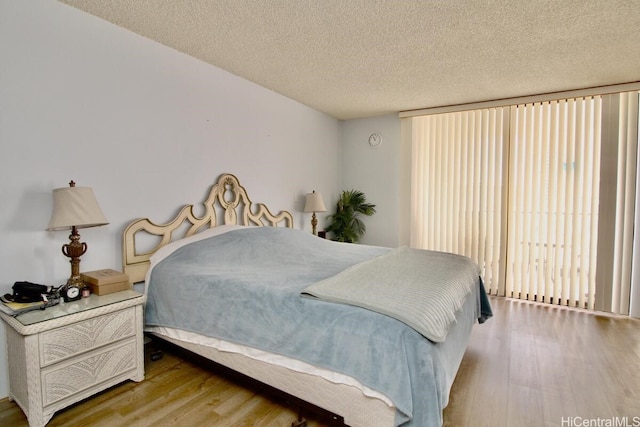 1860 Ala Moana Blvd Unit 910, Honolulu, HI 96815 - bedroom featuring wood finished floors and a textured ceiling