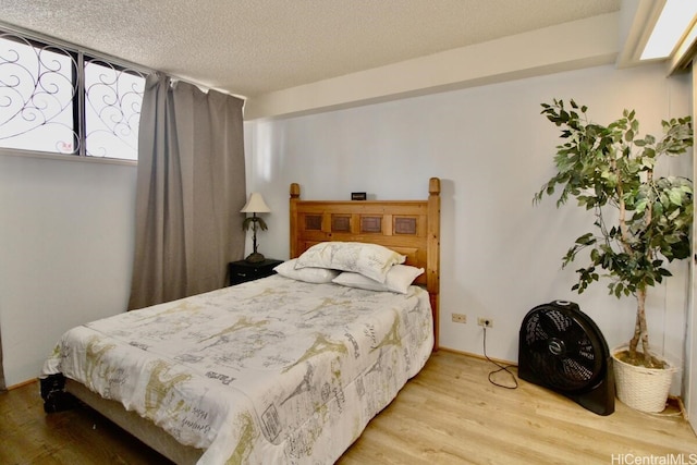 1860 Ala Moana Blvd Unit 910, Honolulu, HI 96815 - bedroom with wood finished floors and a textured ceiling