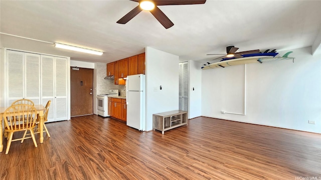 1655 Makaloa St Unit 903, Honolulu, HI 96814 - kitchen featuring white appliances, a ceiling fan, light countertops, and brown cabinets