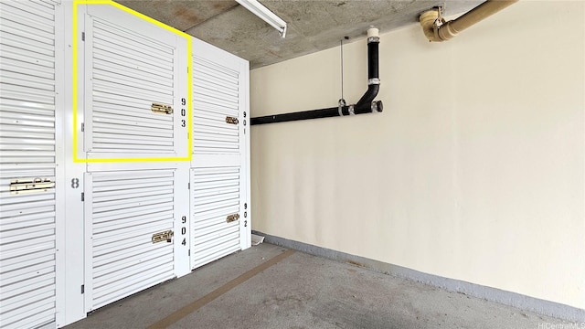 1655 Makaloa St Unit 903, Honolulu, HI 96814 - garage featuring baseboards