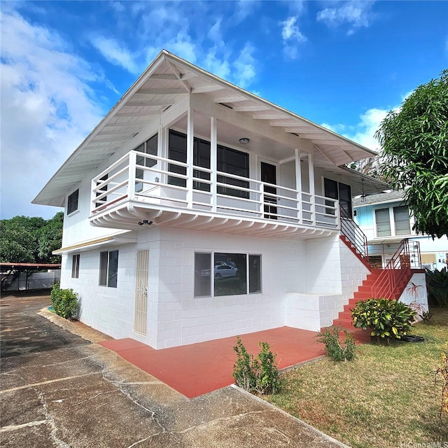 3216 Kaimuki Ave, Honolulu, HI 96816 - rear view of property with concrete block siding, stairs, and a balcony