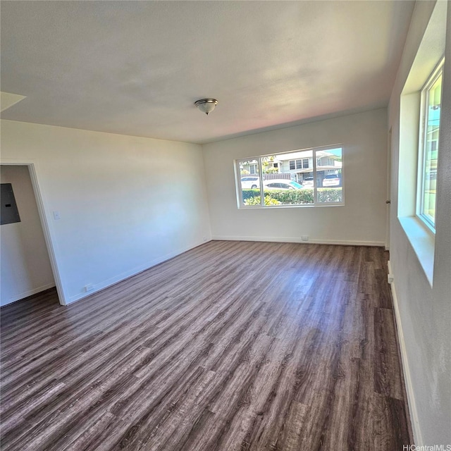 3216 Kaimuki Ave, Honolulu, HI 96816 - empty room with dark wood-type flooring and baseboards