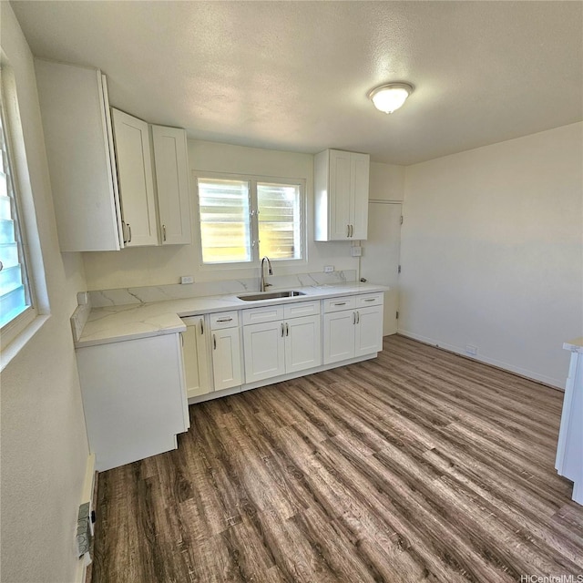 3216 Kaimuki Ave, Honolulu, HI 96816 - kitchen with dark wood-type flooring, white cabinets, and a textured ceiling
