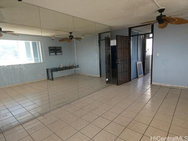 2421 Ala Wai Blvd Unit 1701, Honolulu, HI 96815 - spare room with ceiling fan and light tile patterned flooring