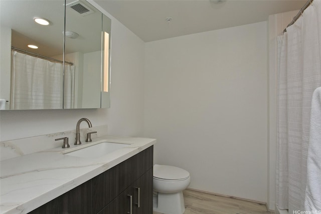 615 Keawe St Unit 1903, Honolulu, HI 96813 - full bathroom featuring vanity, wood finished floors, and recessed lighting