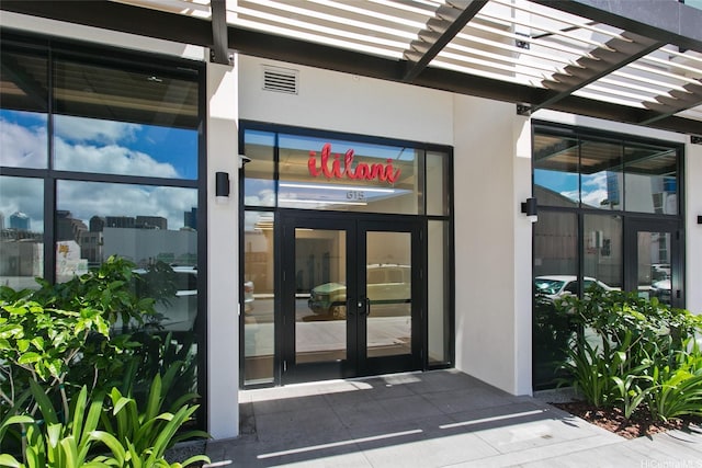 615 Keawe St Unit 1903, Honolulu, HI 96813 - doorway to property with french doors, stucco siding, and a pergola