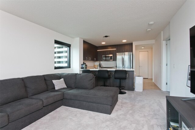 615 Keawe St Unit 1903, Honolulu, HI 96813 - living room featuring light colored carpet, a textured ceiling, and recessed lighting