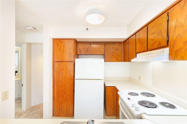 930 Kaheka St Unit 802, Honolulu, HI 96814 - kitchen featuring white appliances, under cabinet range hood, brown cabinetry, light countertops, and light colored carpet