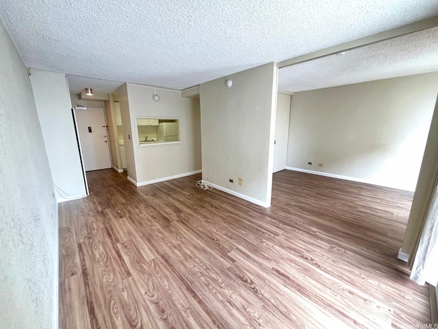 1617 Kapiolani Blvd Unit 1003, Honolulu, HI 96814 - empty room with wood finished floors and a textured ceiling