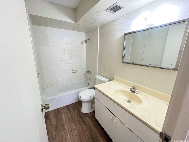 1617 Kapiolani Blvd Unit 1003, Honolulu, HI 96814 - full bath with wood finished floors, vanity, and shower / tub combination
