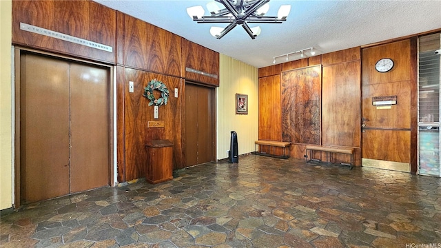 1848 Kahakai Dr Unit 1502, Honolulu, HI 96814 - building lobby with wooden walls and a textured ceiling