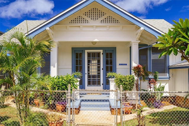 3413 Winam Ave, Honolulu, HI 96815 - entrance to property with a gate, roof with shingles, and a porch
