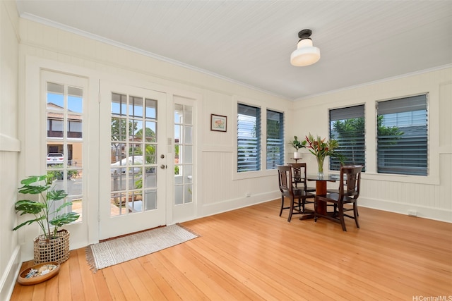 3413 Winam Ave, Honolulu, HI 96815 - dining space featuring crown molding, light wood-type flooring, and a decorative wall