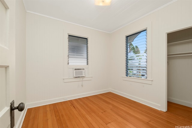3413 Winam Ave, Honolulu, HI 96815 - unfurnished bedroom with crown molding, hardwood / wood-style flooring, a closet, and cooling unit