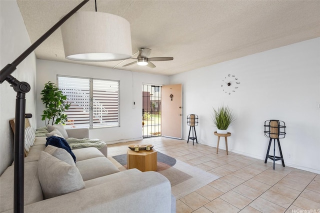 3225 Ala Ilima St Unit 2, Honolulu, HI 96818 - living room featuring a ceiling fan, light tile patterned floors, and a textured ceiling