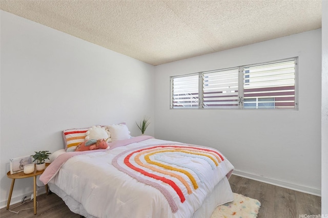 3225 Ala Ilima St Unit 2, Honolulu, HI 96818 - bedroom featuring wood finished floors and a textured ceiling