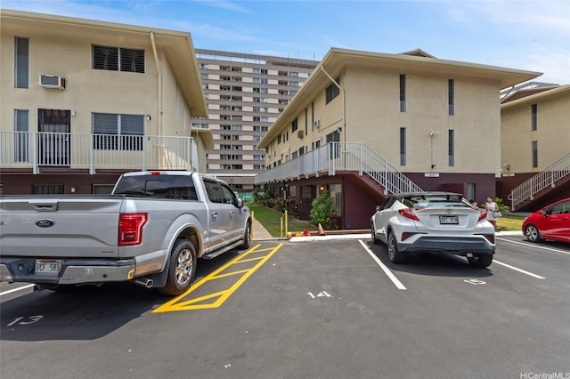 3225 Ala Ilima St Unit 2, Honolulu, HI 96818 - uncovered parking lot with stairs and an AC wall unit