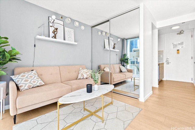 2427 Kuhio Ave Unit 1205, Honolulu, HI 96815 - living area with light wood-style floors