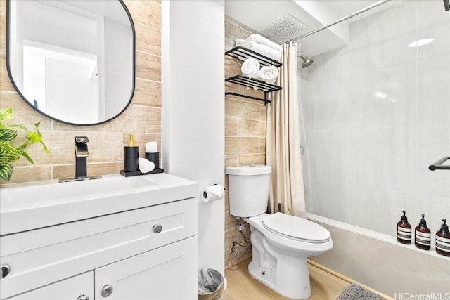 2427 Kuhio Ave Unit 1205, Honolulu, HI 96815 - full bath with tile walls, vanity, shower / bath combination with curtain, and tasteful backsplash