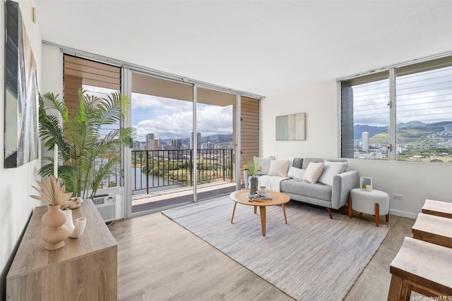 2345 Ala Wai Blvd Unit 1918, Honolulu, HI 96815 - living area with wood finished floors, a wall of windows, and a city view