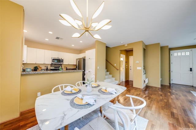 580 Lunalilo Home Rd Unit 358, Honolulu, HI 96825 - dining room featuring wood finished floors, stairs, a chandelier, and recessed lighting