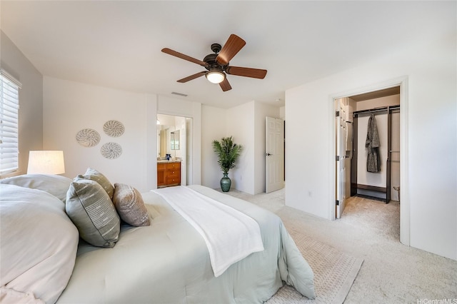 580 Lunalilo Home Rd Unit 358, Honolulu, HI 96825 - bedroom with light carpet, a walk in closet, ceiling fan, and ensuite bathroom