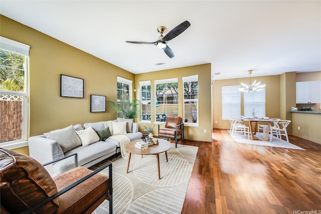 580 Lunalilo Home Rd Unit 358, Honolulu, HI 96825 - living room with wood finished floors, a ceiling fan, and a chandelier