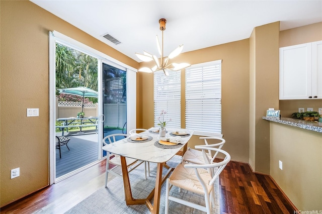 580 Lunalilo Home Rd Unit 358, Honolulu, HI 96825 - dining space featuring wood finished floors and a chandelier