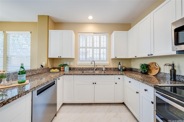580 Lunalilo Home Rd Unit 358, Honolulu, HI 96825 - kitchen with stainless steel appliances, white cabinetry, dark stone countertops, light marble finish floors, and recessed lighting