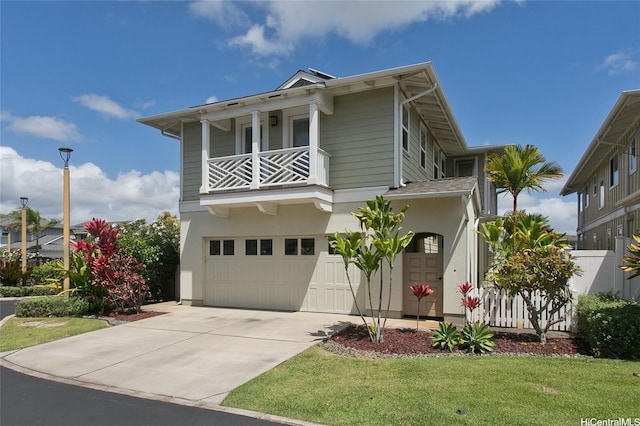 91-1526 Kaikohola St Unit D1, Ewa Beach, HI 96706 - view of front of house with a balcony, a garage, concrete driveway, and stucco siding
